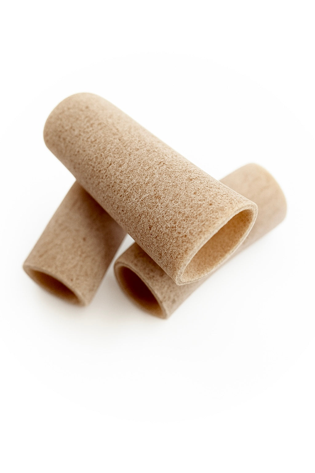 individual pieces of organic wholegrain spelt maccheroni pasta from carleschi