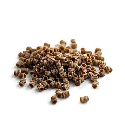 small pile of organic wholegrain einkorn ditalini pasta from carleschi 