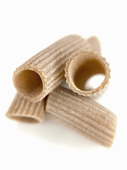 indivdiual pieces of organic wholegrain rivet rigatoni pasta from carleschi 