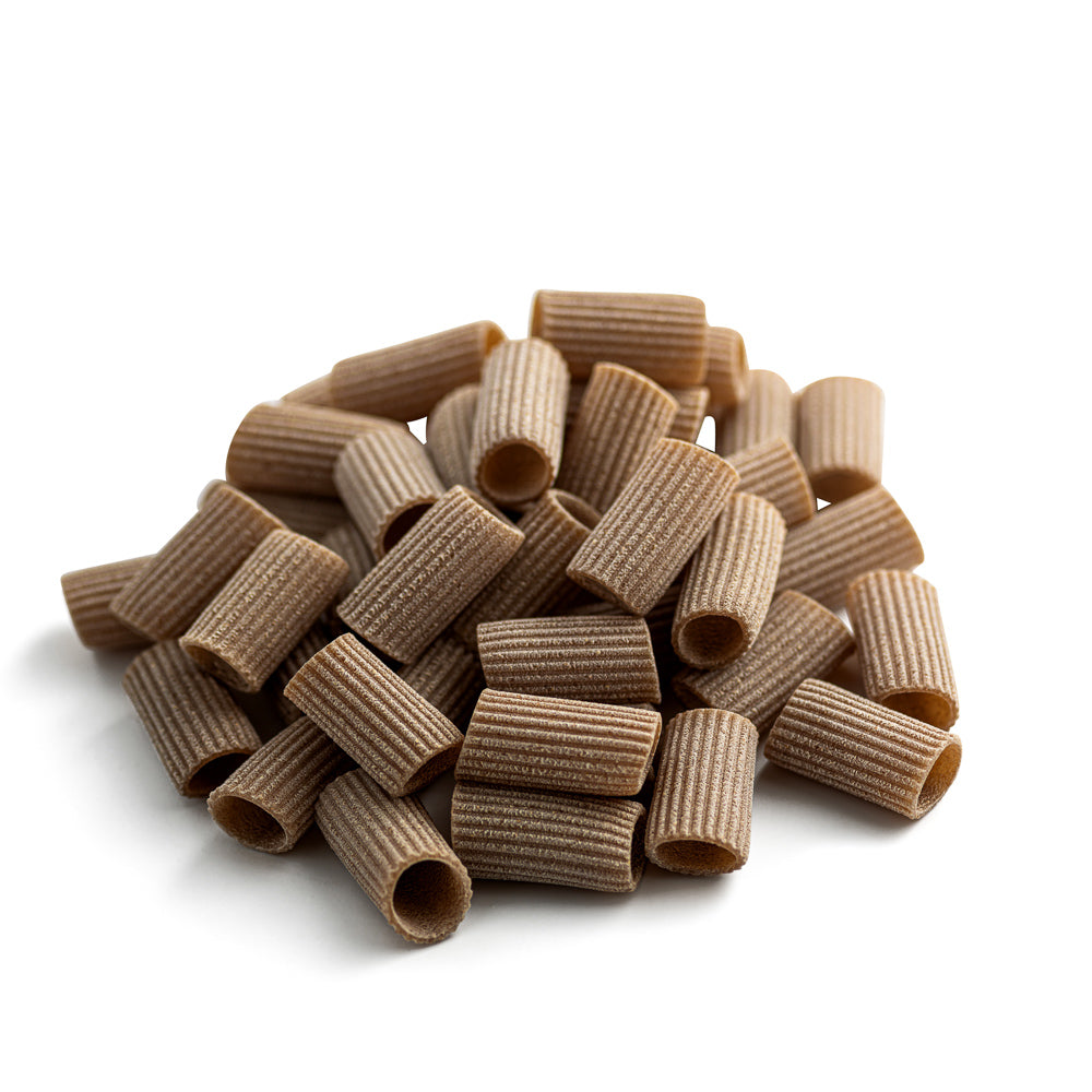small pile of organic wholegrain rivet rigatoni pasta from carleschi 