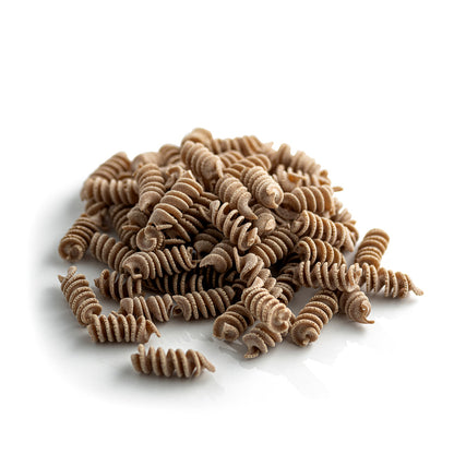 small pile of organic wholegrain spelt fusilli pasta from carleschi 